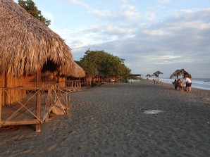 The warm sunset glow on the various cabins and restaurant of Palo de Oro